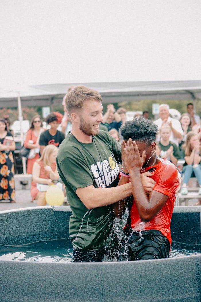 our-experience Joyful outdoor baptism ceremony at a community gathering in Clemson.